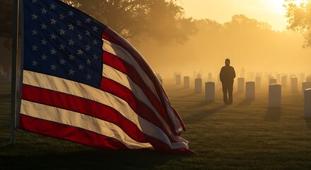 Man walks through misty cemetery with American flag waving in foreground on a solemn Memorial Day morning, honoring fallen heroes and remembering their sacrifice.