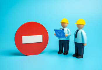 Construction workers have stopped work. Work is prohibited. Suspension of building, safety violations, and legal issues. Labor law, real estate, and industry crisis themes.