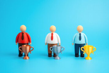 Office workers with first, second, and third place winners' cups. Competition and rivalry. Best employee. Recognition, performance evaluation, and corporate motivation. HR and success themes.