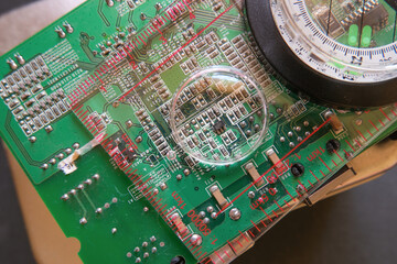 A close-up view of the microelectronic world: A circuit under the magnifying glass. Selected focus.
