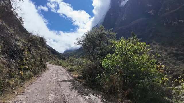 Huaraz, Peru: Point of view footage from motorcycle riding on offroad to laguna paron in border of Huascaran national park in Peru. Showing high and cloudy mountains