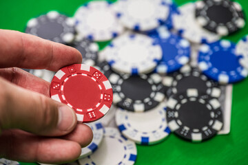 Four kings poker hand with chips and cash.