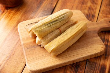 Tamales. Traditional food typical of Mexico and some Latin American countries. Corn dough wrapped in corn leaves. The tamales are steamed.