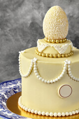 Delicious white chocolate easter cake decorated with coconut egg