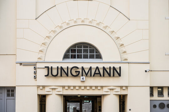 Helsinki, Finland - August 08 2025: Facade of Jungmann building with decorative arch.