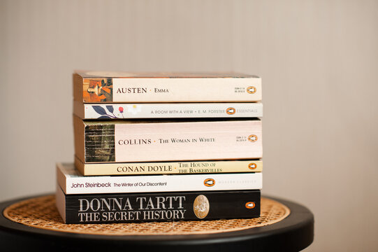 Paris, France - October 15, 2025: stack of paper books of publishing house Penguin classic close up. Modern literature.