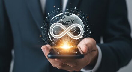 Businessman holding smartphone displaying glowing infinity symbol over digital globe with network connections
