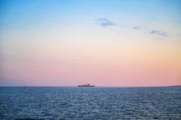 The grey warship on the sea.