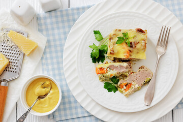 Cheesy ground meat vegetables casserole on a plate