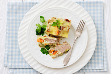 Cheesy ground meat vegetables casserole on a plate