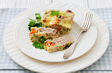 Cheesy ground meat vegetables casserole on a plate