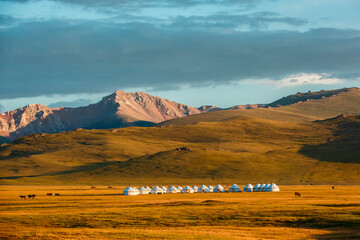 Nomadic yurt camp in the mountain valley of Son-Kul Lake, Kyrgyzstan. Traditional lifestyle and...