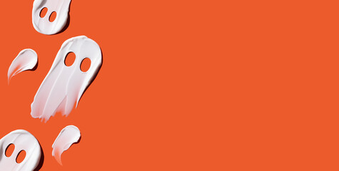 Halloween concept, ghosts in the form of cosmetic smears on an orange background. Skin moisturizing in autumn. Ghost concept