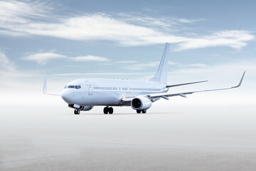 White passenger aircraft isolated on bright background with sky