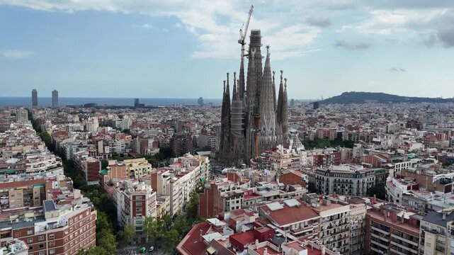 Aerial orbit from right to left around Sagrada Fam&iacute;lia basilica, Barcelona, Spain