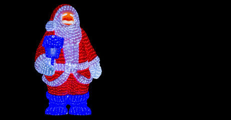 LED Santa Claus light decoration Christmas illumination figure isolated on a pure black background