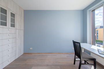 Home Living Room Interior. Wooden Floor, Bright Blue Color Walls, Window. 