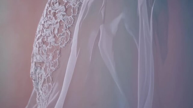 Soft-focus video still of delicate lace fabric draped elegantly, captured from a top-down angle, creating a dreamy, ethereal atmosphere. Live desktop wallpaper.