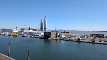 Naklejka premium View of the harbor and Saint-Nazaire Bridge over the Loire estuary, France.