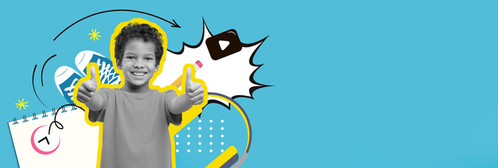 A joyful child stands in front of a colorful backdrop, enthusiastically giving thumbs up.