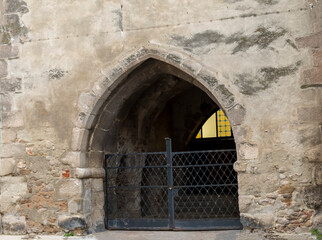 Fototapeta premium Old stone arch and gate of medieval building in Austria