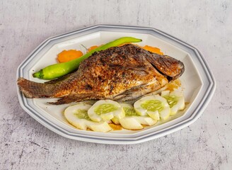 Inihaw na Tilapia Grilled Fish Charcoal-grilled tilapia with cucumber and chili