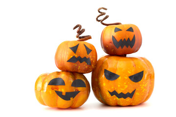 Cute Halloween pumpkins with jack-o'-lantern faces arranged in a playful group on a white background