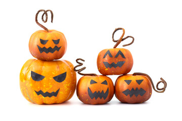Cute Halloween pumpkins with jack-o'-lantern faces arranged in a playful group on a white background