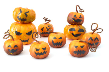 Cute Halloween pumpkins with jack-o'-lantern faces arranged in a playful group on a white background