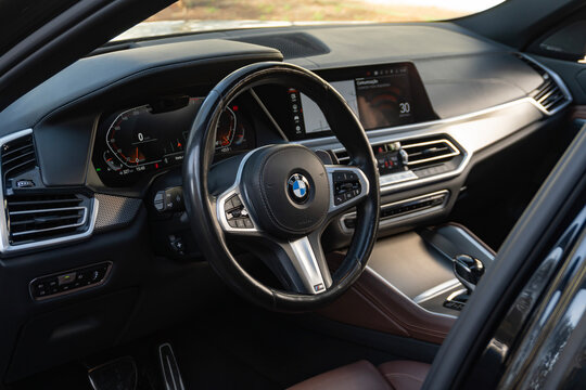 BMW X6 M Sport steering wheel and digital cockpit, luxury SUV coupe interior view


