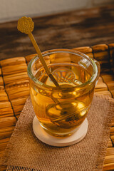 Close-up of Golden Tea Infuser in Mug