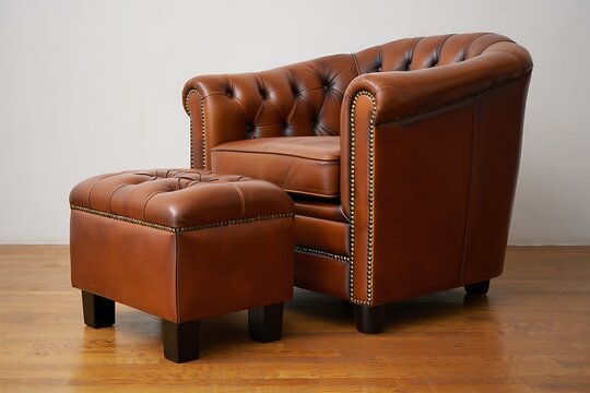 Classic brown leather chesterfield armchair and matching ottoman furniture set