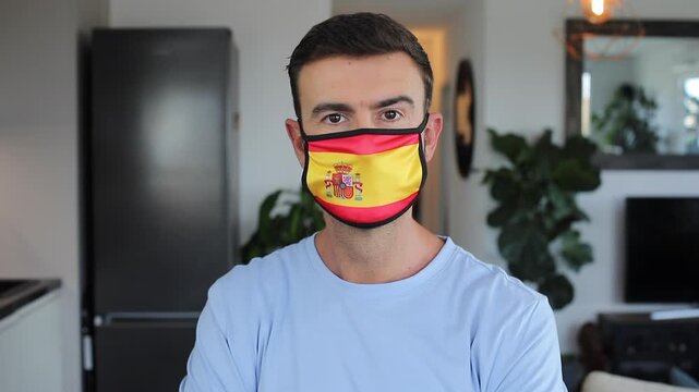 Man Wearing a Face Mask with the Flag of Spain for Virus Protection