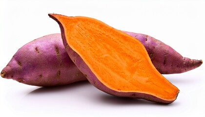two purple sweet potatoes one sliced open orange flesh isolated on a white background