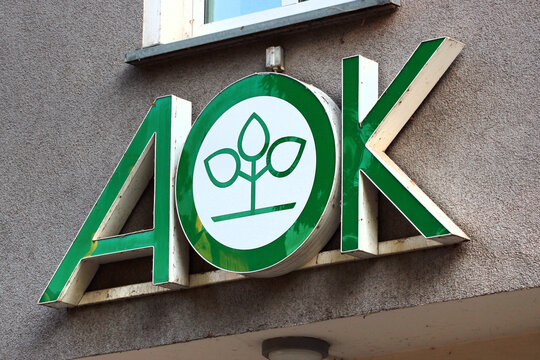 Greiz, Germany - June 9, 2023: AOK Plus Logo Sign on Building Wall, a leading German Health Insurance Company