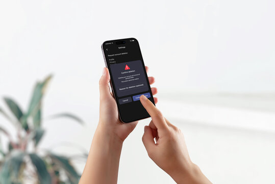 Smartphone screen showing GDPR interface with warning and confirmation for account deletion, representing right to erasure and user data control.