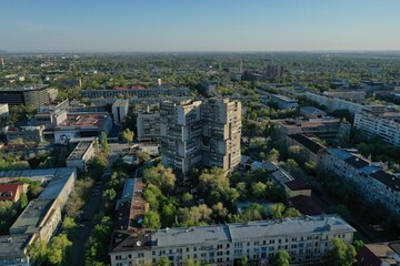Aerial cityscape view showing brutalist apartment building