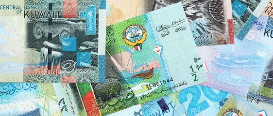 Kuwaiti dinar currency money bills. The current banknotes lies on table in big amount close up