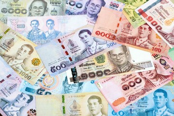 Thai baht currency money. The current banknotes lies on table in big amount close up
