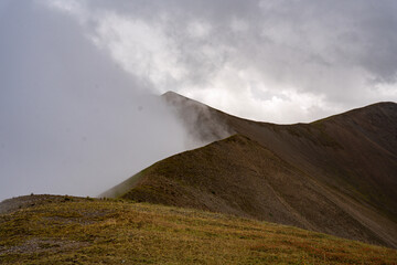 Sunlight Breaking Through Storm Clouds Over The Caucasus Mountains Near Ushguli Georgia: Dramatic Landscape Of Light, Shadow And Wilderness