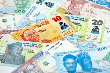 Nigerian naira currency money. The current banknotes lies on table in big amount close up