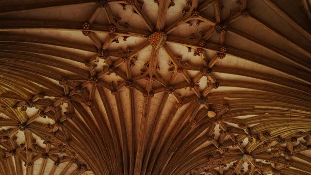 The cloisters of Canterbury Cathedral, Canterbury, Kent, England, UK, with arcaded walks, a quiet garth and stone tracery in soft light