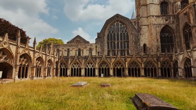 The cloisters of Canterbury Cathedral, Canterbury, Kent, England, UK, with arcaded walks, a quiet garth and stone tracery in soft light