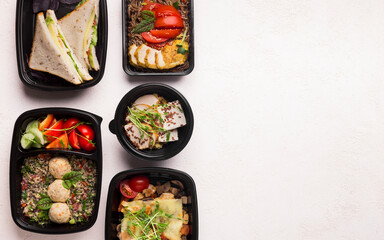 Be healthy. Healthy food delivery in black boxes to go on white background with copy space for...