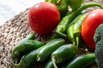 Close-Up of Green Vegetables and Tomatoes: Broccoli, Cucumber, and Pepper
