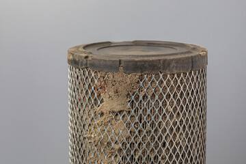 Dirty air filter for cab of farm tractor or combine harvester. Agriculture and farming equipment repair, maintenance and service concept
