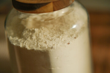Glass Jar of Flour Infested with Weevils in Kitchen