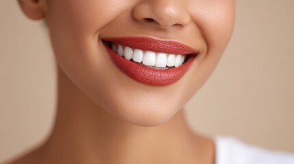 Fototapeta premium Bright smile showcasing perfect teeth and subtle makeup against a soft background.