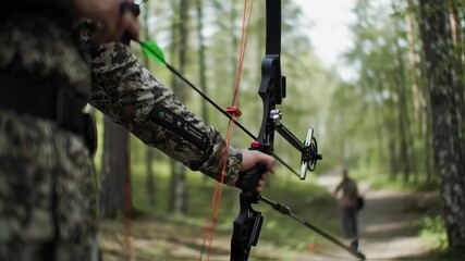 Archer Aims Bow in Forest: Archery Practice and Outdoor Sport - Powered by Adobe