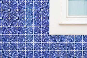 Detailed close-up of traditional Portuguese Azulejo tiles featuring an intricate blue and white geometric pattern, the texture is framed by a clean white window border perfect for backgrounds